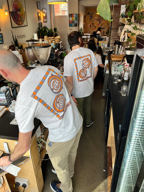 The COTC team working behind the counter in their branded Tee shirts